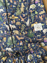 Load image into Gallery viewer, Fabric and trim detail for kids Christmas pyjamas
